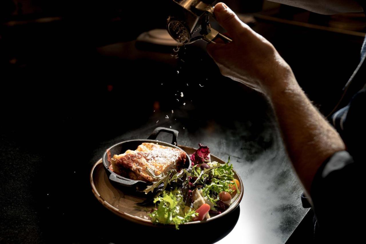 Peppers Waymouth Hotel Adelaide Bagian luar foto A chef seasoning a dish